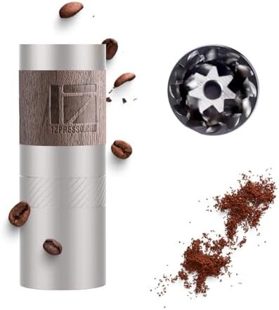 Compact manual coffee grinder with foldable handle