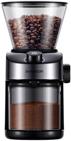Flat burr coffee grinder with chamber cleaning button